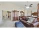 Bright bedroom with a seating area, a canopy bed, warm tones, and plenty of natural light at 5957 W Robin Ln, Glendale, AZ 85310