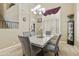 Dining room with a marble table set and staircase in background at 5957 W Robin Ln, Glendale, AZ 85310