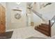 Bright and airy entryway features tile flooring and a staircase leading to the upper level at 5957 W Robin Ln, Glendale, AZ 85310