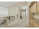 Upstairs hallway with carpet, storage, and decorative railing at 5957 W Robin Ln, Glendale, AZ 85310