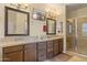 Well-appointed bathroom features dual vanities, mirrors, and a tiled walk-in shower for a spa-like experience at 6231 E Mark Way # 14, Cave Creek, AZ 85331