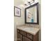 Stylish bathroom vanity featuring a marble countertop, dark wood cabinets, and a modern mirror with vanity lighting at 6231 E Mark Way # 14, Cave Creek, AZ 85331