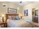 Cozy bedroom with a decorative bed frame and an ensuite bathroom at 6231 E Mark Way # 14, Cave Creek, AZ 85331