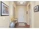 Inviting foyer with hardwood floors, an arched doorway, and elegant decor at 6231 E Mark Way # 14, Cave Creek, AZ 85331