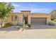 Charming single-story home with a two-car garage, desert landscaping and a beautiful tile roof at 6231 E Mark Way # 14, Cave Creek, AZ 85331