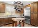Modern kitchen features stainless steel appliances, custom cabinetry, and a central island with butcher block countertop at 6231 E Mark Way # 14, Cave Creek, AZ 85331