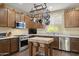 Gourmet kitchen boasting stainless steel appliances, granite counters, and a center island with a butcher block top at 6231 E Mark Way # 14, Cave Creek, AZ 85331