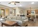 Open-concept living room with hardwood floors and a dining area at 6231 E Mark Way # 14, Cave Creek, AZ 85331