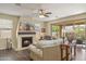 Cozy living room with a fireplace and access to the backyard at 6231 E Mark Way # 14, Cave Creek, AZ 85331