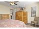 This main bedroom provides ample storage with multiple dressers and a chair by a window at 6231 E Mark Way # 14, Cave Creek, AZ 85331