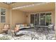Cozy covered patio with ample seating, an outdoor table setting, and shaded views of the surrounding landscape at 6231 E Mark Way # 14, Cave Creek, AZ 85331