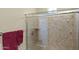 Bathroom featuring a glass shower with stone walls and stainless steel fixtures at 6231 E Mark Way # 14, Cave Creek, AZ 85331