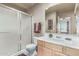 Neutral bathroom featuring a glass enclosed shower and light wood vanity at 7101 W Beardsley Rd # 542, Glendale, AZ 85308