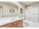 Neutral bathroom featuring a glass enclosed shower and light wood vanity at 7101 W Beardsley Rd # 542, Glendale, AZ 85308