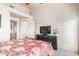Bedroom with vaulted ceiling, queen bed, and a dresser with a flat screen TV at 7101 W Beardsley Rd # 542, Glendale, AZ 85308