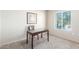 Bedroom featuring a desk, neutral carpet, and a large window at 7101 W Beardsley Rd # 542, Glendale, AZ 85308