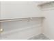 Walk-in closet showing carpet and hanging rods for organized storage at 7101 W Beardsley Rd # 542, Glendale, AZ 85308
