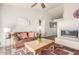 Bright living room featuring a fireplace, plush sofa, and decorative elements at 7101 W Beardsley Rd # 542, Glendale, AZ 85308