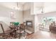 Open-concept dining space with fireplace and bright open living area at 7101 W Beardsley Rd # 542, Glendale, AZ 85308