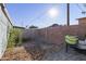 Backyard with gravel ground cover, block wall fence and patio area at 7132 N 63Rd Dr, Glendale, AZ 85301