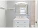 Bathroom vanity featuring a marble countertop, sink, and a framed mirror at 7132 N 63Rd Dr, Glendale, AZ 85301