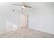 Well-lit bedroom with ceiling fan, closet, neutral carpet, and fresh paint at 7132 N 63Rd Dr, Glendale, AZ 85301