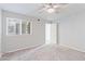 Spacious bedroom with carpet, ceiling fan and window offering bright natural lighting at 7132 N 63Rd Dr, Glendale, AZ 85301