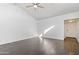 Bright, spacious living room with gray vinyl floors and a vaulted ceiling at 7132 N 63Rd Dr, Glendale, AZ 85301
