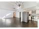 Open floor plan featuring the living room, kitchen, and dining area with stainless steel appliances at 7132 N 63Rd Dr, Glendale, AZ 85301