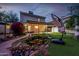 Inviting backyard with a fire pit, patio, a pond and an open grassy area at 725 W Portland St, Phoenix, AZ 85007
