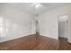 A serene and spacious bedroom with wood floors and ample natural light at 725 W Portland St, Phoenix, AZ 85007