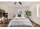 Cozy bedroom features tile floors, a comfortable bed, and natural light from windows at 725 W Portland St, Phoenix, AZ 85007