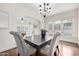 Dining room with hardwood floors, natural light, and stylish lighting at 725 W Portland St, Phoenix, AZ 85007