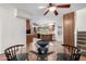 Open dining area with modern furnishings, a glass top table, and views into the kitchen at 725 W Portland St, Phoenix, AZ 85007