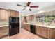 Well-lit kitchen with stainless steel appliances and granite countertops at 725 W Portland St, Phoenix, AZ 85007