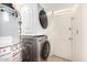 Efficient laundry room features a stacked washer/dryer set and a water heater, maximizing space at 725 W Portland St, Phoenix, AZ 85007