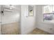 Bright living area featuring tile floors, fresh white paint, and views into adjacent rooms at 725 W Portland St, Phoenix, AZ 85007