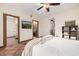 This bedroom features tile floors, wood trim, a walk-in closet, and a view to the ensuite bathroom at 725 W Portland St, Phoenix, AZ 85007