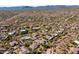 Panoramic aerial view of a sprawling residential community nestled in an arid desert environment at 7335 E Quail Track Rd, Scottsdale, AZ 85266