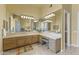 Large vanity in bathroom with multiple mirrors and a bright, open feel at 7335 E Quail Track Rd, Scottsdale, AZ 85266
