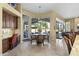 Bright dining area with views, built-in desk, and access to an outdoor patio at 7335 E Quail Track Rd, Scottsdale, AZ 85266