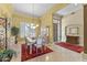 Formal dining area with an elegant chandelier, stylish window shutters, and direct access to the foyer at 7335 E Quail Track Rd, Scottsdale, AZ 85266