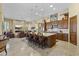 Spacious kitchen with a large island, bar seating, and stainless steel appliances is perfect for cooking and entertaining at 7335 E Quail Track Rd, Scottsdale, AZ 85266