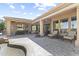 Inviting outdoor patio with seating, a built-in grill, and serene views at 7335 E Quail Track Rd, Scottsdale, AZ 85266