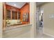 Stylish wet bar featuring custom cabinets, elegant countertops, and an open view of the adjacent rooms at 7335 E Quail Track Rd, Scottsdale, AZ 85266