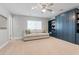 A large, comfortable living room with built-in bookcase and cabinets, plus a cozy sofa with colorful throw pillows at 7533 N 8Th St, Phoenix, AZ 85020