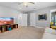 Spacious living room with media center, fan, and access to other rooms at 7533 N 8Th St, Phoenix, AZ 85020