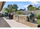 Convenient outdoor kitchen featuring a built-in BBQ grill, stainless steel drawers, and a Big Green Egg smoker at 7533 N 8Th St, Phoenix, AZ 85020