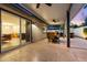Spacious patio with a ceiling fan, comfortable seating, and sliding glass doors leading to the interior at 7533 N 8Th St, Phoenix, AZ 85020