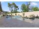 Inviting backyard pool featuring a waterfall feature and a spacious deck, perfect for relaxation and entertainment at 7533 N 8Th St, Phoenix, AZ 85020